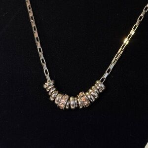 Silver Necklace with rings and orange rhinestone beads